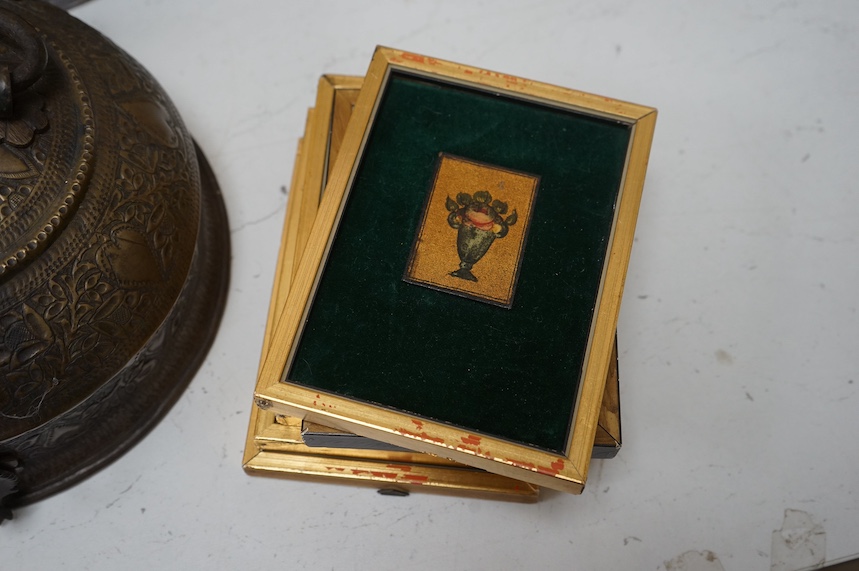 An Ethiopian Coptic processional cross, two Indian brass betel nut boxes together with other metalware and a set of miniature paintings, largest 51cm high. Condition - fair